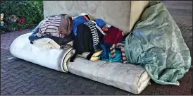  ??  ?? Encampment: Belongings stacked on rolled up mattresses