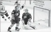  ?? ?? TREVOR LEWIS raises arms after a goal as Jackson LaCombe, left, and Lukas Dostal of the Ducks react.