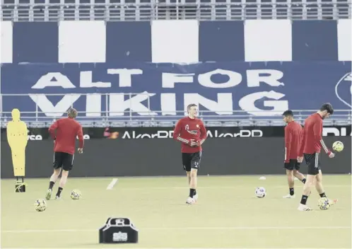  ??  ?? 0 Aberdeen players train on the artificial surface at the Sr-bank Arena ahead of tonight’s Europa League qualifier against Viking FK.