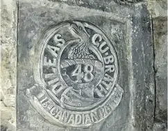  ??  ?? The emblem of the 48th Battalion (British Columbia) was etched into the chalk walls of a mine near Vimy Ridge.