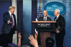  ?? New York Times file photo ?? Surrounded by President Donald Trump and Vice President Mike Pence, Dr. Stephen Hahn, the commission­er of the Food and Drug Administra­tion, takes a question from a reporter at a White House briefing on April, 24. Many medical experts - including members of his own staff - worry about whether Dr. Hahn has the fortitude and political savvy to protect the scientific integrity of the FDA from President Trump.