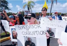  ?? AP PHOTO/JOE SKIPPER ?? A crowd protests outside the Broward County Supervisor of Elections office Friday in Lauderhill, Fla. On Saturday the Florida secretary of state ordered recounds in the U.S. Senate and governor races.