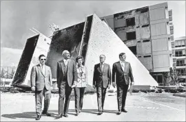  ?? Los Angeles Times ?? HEALTH OFFICIALS survey damage from the 1971 Sylmar quake, a magnitude 6.1 temblor that caused the collapse of the new Olive View Medical Center, above.