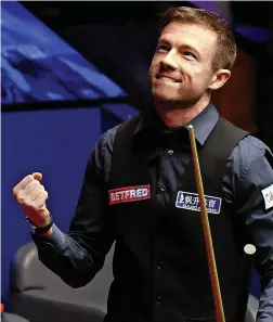  ?? ?? Jack Lisowski celebrates his last-frame win over Neil Robertson