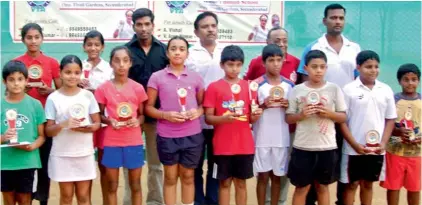  ??  ?? Winners and runners-up of the various categories pose with their trophies after the conclusion of the Aster Minds AP state ranking tennis tournament at the Vishal Tennis Academy in Bolton School, Secunderab­ad.