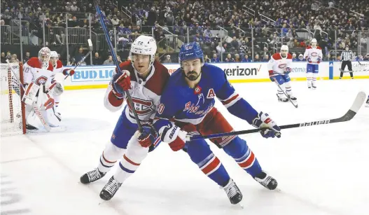  ?? BRUCE BENNETT/GETTY IMAGES ?? Canadiens defenceman Justin Barron, left, checks Rangers forward Chris Kreider in the Montreal zone during game in New York on Sunday.