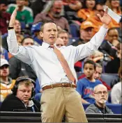  ?? JEFF ROBERSON / AP ?? Florida’s Mike White, here directing his Gators against Arkansas, says a snub by ESPN analyst Seth Davis will again be used to move his team.