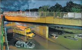  ??  ?? Cars stranded on an expressway in Brooklyn following heavy rain in New York on Wednesday.