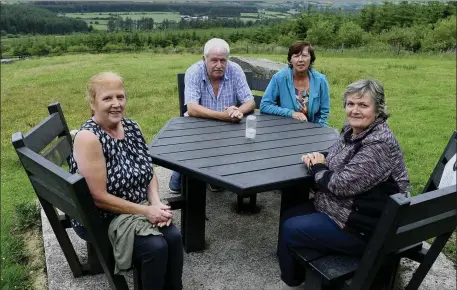  ??  ?? Macroom’s Anne Carroll met up with Kathleen Linehan, Mary and Ben Cotter at St. John’s Well on the slopes of Mushera Mountain.