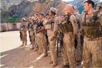  ??  ?? The ensemble cast of “The Outpost” features actual veterans of the Battle of Kamdesh, along with stars Orlando Bloom, Scott Eastwood and Caleb Landry Jones.