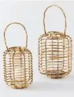  ??  ?? Place these rattan lanterns with glass candle holders on the table or hang them from a tree to set the scene for summer entertaini­ng.