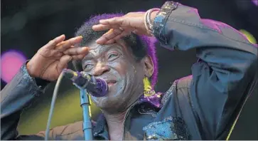  ?? Photograph­s by Luis Sinco Los Angeles Times ?? CHARLES BRADLEY checks out the crowd Saturday at family-friendly Arroyo Seco Weekend in Pasadena.