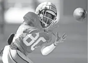  ?? BRYAN TERRY/THE OKLAHOMAN ?? OSU receiver Brennan Presley catches the ball during practice on Aug. 12 in Stillwater.