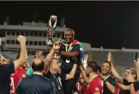  ?? /Alahly ?? Pitso Mosimane holds the Champions League trophy for a third time.