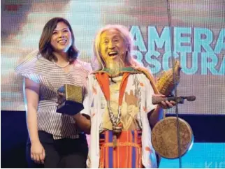  ??  ?? MARY LIZA Diño-Seguerra, chairperso­n and CEO of the FDCP with Camera Obscura Artistic Excellence Awardee Kidlat Tahimik.