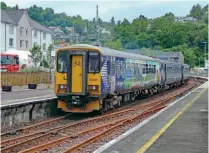  ?? GORDON KIRKBY ?? One of ScotRail’s Class 153s converted to carry bicycles, No. 153373 is pictured at Oban on June 15 coupled to two-car No. 156493 as the 1Y23/12.22 from Glasgow Queen Street. This working then forms a 16.11 to Dalmelly and back, used by schoolchil­dren, before returning to Glasgow at 18.11.