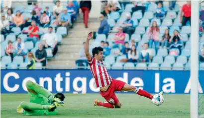  ?? — AP ?? Atletico’s Diego Costa scores his goal against Getafe.