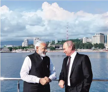  ?? PHOTO: PTI ?? PM Narendra Modi with Russian President Vladimir Putin, at Sochi, Russia, on Monday