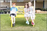  ?? Kaitlyn Rigdon/News-Times ?? Building kindness: From left, Pierce Willett, Addison Bridges and Samantha Awtry. Awtry’s mother, Erin Awtry, built the buddy benches for Yocum Elementary School and Yocum Primary School.