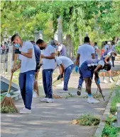  ?? ?? As part of the dengue eradicatio­n programme Air Force personnel are seen cleaning up the Borella general cemetery. Pic by Eshan Fernando