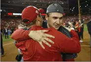  ?? PATRICK SEMANSKY - THE ASSOCIATED PRESS ?? Washington Nationals manager Dave Martinez and Ryan Zimmerman celebrate after Game 4 of the National League Championsh­ip Series against the St. Louis Cardinals Tuesday, Oct. 15, 2019, in Washington.