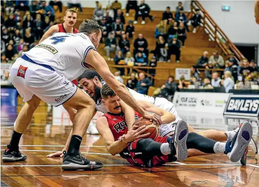 ?? PHOTOSPORT ?? Cameron Gliddon, seen here wrestling for possession on the floor, has been the standout performer for the resurgent Canterbury Rams this season.