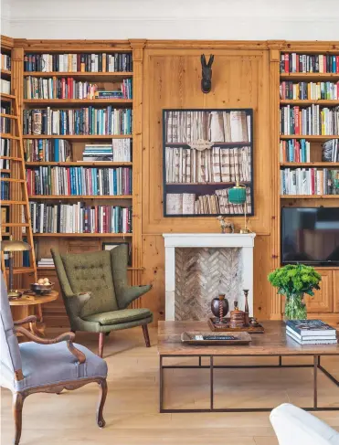  ??  ?? LIBRARYApp­ealing finishes are a feature of this wood-clad scheme (left). Herringbon­e brickwork embellishe­s the fireplace, while the base of the coffee table was left in the garden to develop its rusty patina before being topped with a piece of antique teak from Indonesia. Turned wood cups and candlestic­ks (below) suit the tactile theme.