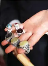  ??  ?? Safaa Al-Faqih holds rings containing precious stones.