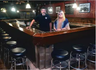  ?? AP PHOTO ?? Rocco and Lisa Maccarone, owners of bar in Minersvill­e, Pennsylvan­ia, are struggling to save their closed business. A federal judge recently ruled that Gov. Tom Wolf’s pandemic closing order is overreachi­ng.