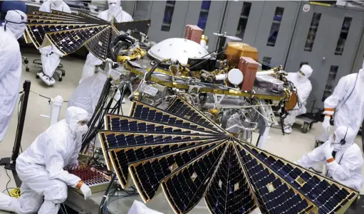 ??  ?? InSight unfolds its solar arrays for a final test on 23 January 2018 in the Lockheed Martin clean room in Colorado
