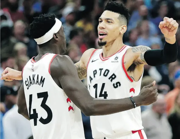  ?? JOHN RAOUX / THE ASSOCIATED PRESS ?? Toronto’s Danny Green celebrates his game-winning shot with teammate Pascal Siakam in Orlando on Tuesday night.