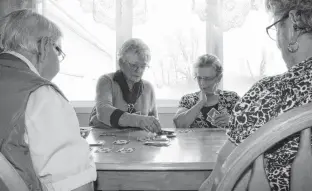  ?? KRISTIN GARDINER ?? For Mary MacInnis, left Mary Webster Houston, Mary Ramsay and Mary Cousins, weekly card games are a great way for retired seniors to stay socially active and keep their minds sharp.