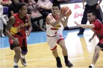  ??  ?? STAR’S rookie Jio Jalalon (middle) gets past Gabby Espinas (left) and RR Garcia of San Miguel Beer during the opening game of the PBA’s 42nd season. The Beermen won, 96-88.