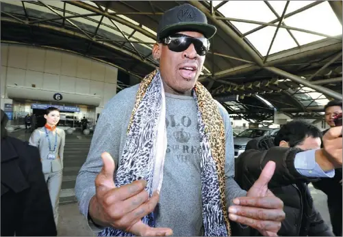  ?? KYODO NEWS / ASSOCIATED PRESS ?? Former NBA star Dennis Rodman speaks to journalist­s at Capital Internatio­nal Airport in Beijing after arriving from Pyongyang on Dec 23. Rodman is trying to organize a series of exhibition games in the DPRK to promote ‘basketball diplomacy’.