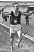  ??  ?? Bruce Tulloh (with shoes) winning the three-mile event at White City, London, in 1964.
