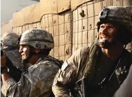  ?? SCREEN MEDIA ?? Scott Eastwood (right) plays one of the U.S. soldiers stationed in a vulnerable base in eastern Afghanista­n in “The Outpost.”