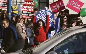  ?? Lance Iversen / The Chronicle 2005 ?? Pro Choice people celebrate motorist-honking horns in support along San Francisco’s Embarcader­o.