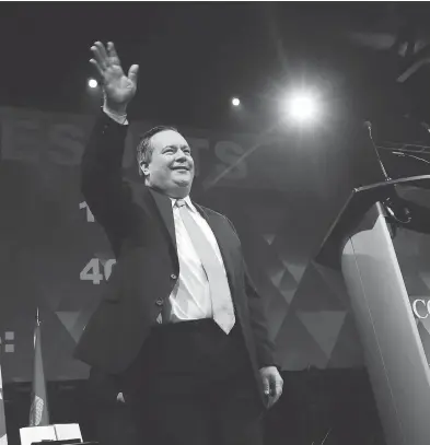  ?? GAVIN YOUNG / POSTMEDIA NETWORK ?? Jason Kenney waves to the crowd after winning the Alberta PC leadership in downtown Calgary on Saturday.