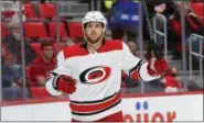  ?? PAUL SANCYA — THE ASSOCIATED PRESS ?? In this Jan. 20, 2018 file photo Carolina Hurricanes center Elias Lindholm celebrates his goal against the Detroit Red Wings in the first period of an NHL hockey game in Detroit. end that he’s an Islander.”