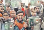  ?? PTI ?? RJD supporters raise slogans in Prasad’s support outside his residence, in Patna on Saturday.