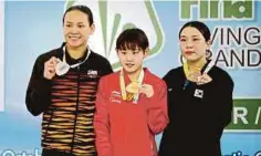  ?? FOTO: ?? PANDELELA (kiri) raih perak acara 10m platform wanita final pada GP KL.