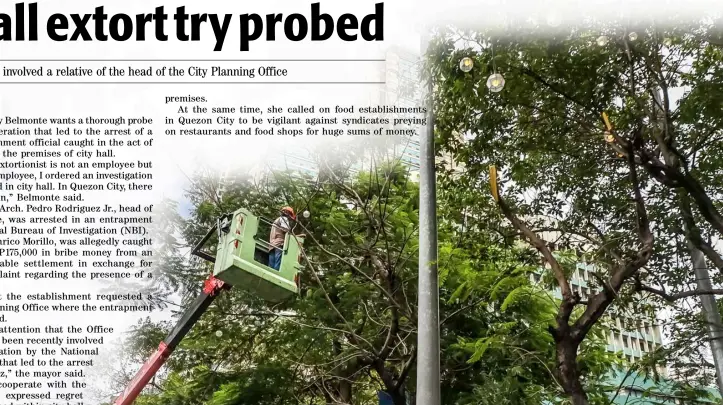  ??  ?? Holiday spirit A crew from Manila City Hall installs capiz Christmas lanterns on lamp posts to usher in the holiday season.