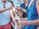  ?? ROD LAMKEY JR./EPA-EFE ?? Thousands of people march during a vigil Friday to remember the five Capital Gazette employees slain in Annapolis, Md.