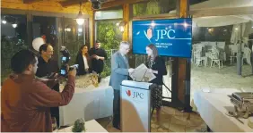  ?? (Steve Linde) ?? URI DROMI receives a memento of his years at the helm of JPC from his successor, Talia Dekel-Fleissig.