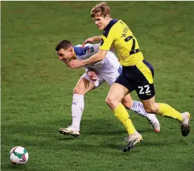  ??  ?? Oxford United’s Rob Atkinson, right, in action against Tranmere Rovers