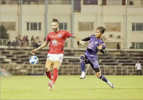  ?? SVAY RIENG FC ?? Marcus Haber (left) of Svay Rieng challenges Kan Pisal of Tiffy Army on Saturday 26, 2022 at Tiffy Army Stadium.