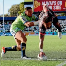  ?? GETTY IMAGES ?? A flying Manu Vatuvei grounds the ball in spectacula­r fashion in Canberra, but the big winger’s efforts turned out to be in vain as the Raiders won 26-22 in golden point.