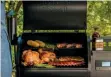  ??  ?? Roast in the machine The drum design equates to 572 square inches of cooking space. Traeger reckons you can pack in 24 burgers, five rib racks or four chickens. Grill, smoke, bake, roast, braise or BBQ: it’s a 6-in-1 cooker, and that includes pizza.