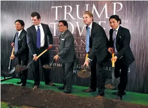  ??  ?? THEY'VE GOT THE DIRT: During the election campaign, Trump’s two sons flew to the Philippine­s to toss some ceremonial sod to celebrate the near completion of a Trump Tower in Makati.