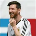  ?? RICARDO MAZALAN — THE ASSOCIATED PRESS ?? Lionel Messi smiles during a training session of Argentina at the 2018 soccer World Cup in Bronnitsy, Russia Sunday.